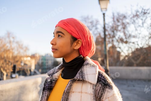 Preview: Young Hispanic woman with pink scarf, concept fight against cancer