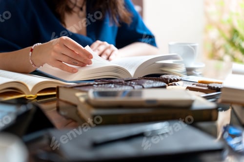 Preview: Writer enjoying reading and snacking on cookies and coffee