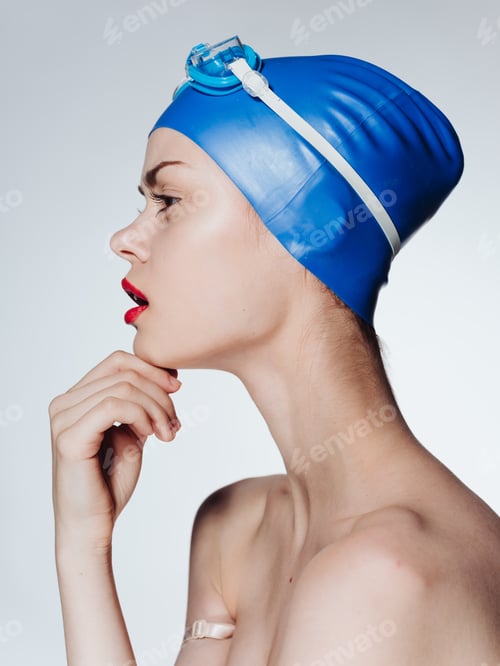 Preview: Beautiful woman with red lips blue swimming cap diving model