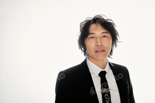 Preview: Stylish young asian man exudes confidence in modern urban fashion setting