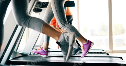 Preview: Group of friends exercising on treadmill machine