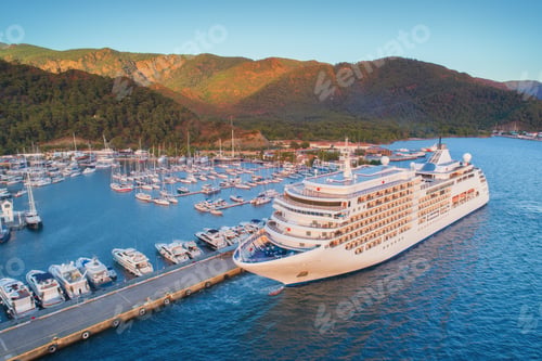 Preview: Aerial view of beautiful large white ship at sunset
