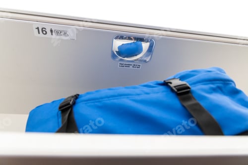 Preview: Reflective mirror on overhead luggage storage in airplane cabin for passenger to verify that all