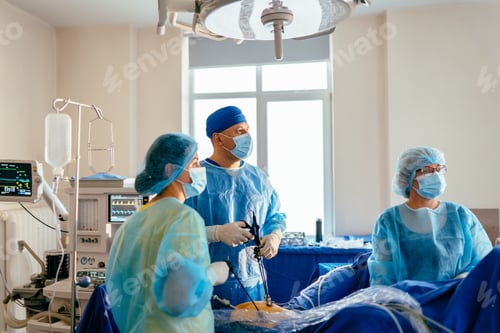 Preview: Medical Team Performing Laparoscopic Surgery in Bright Operating Room