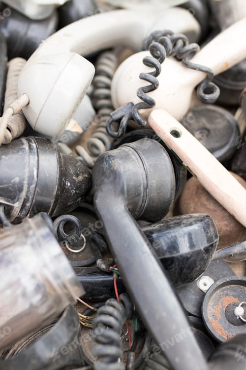 Pile of Old and Discarded Telephone Receivers
