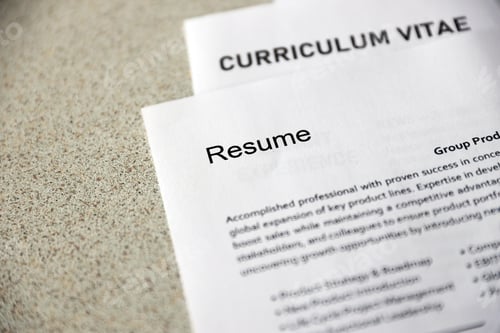Preview: Top view of stack of office documents including resume and cv forms on the desk