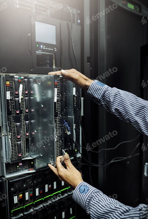 Preview: Cropped shot of an unrecognizable IT technician repairing a computer in a data center