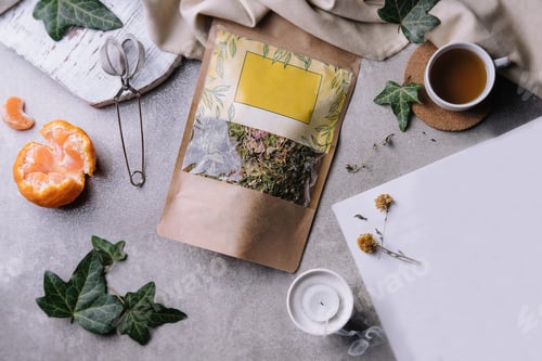Preview: cup of tea with tangerines and tea packaging
