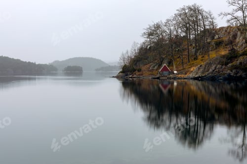 Preview: Red And Blue Boathouse At The Coast