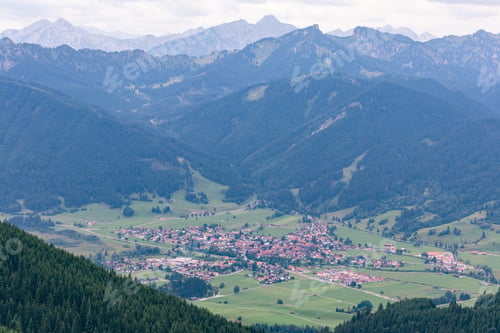 Preview: view from the mountain to the village at the foot and the ski lift
