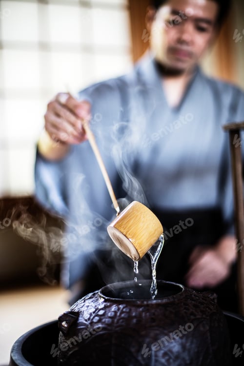 Preview: Traditional Japanese Tea Ceremony, man using a Hishaku, a bamboo ladle in water