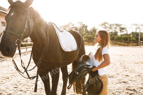 Preview: Beautiful woman with horse in countryside