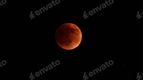 Preview: Blood moon during a lunar eclipse in the night sky. The moon appears red, shadowed by the Earth