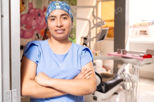 Preview: Dentist posing smiling wearing his uniform