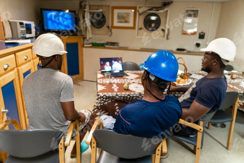 Preview: Seamen crew onboard a ship or vessel having fun watching movie
