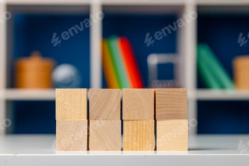 Preview: Blank wooden cubes with copy space for your design on office working table