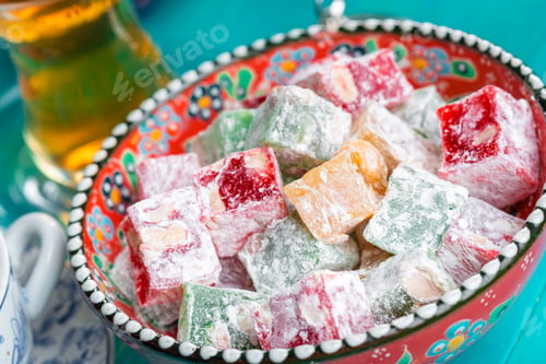 Preview: various pieces of turkish delight lokum and black tea