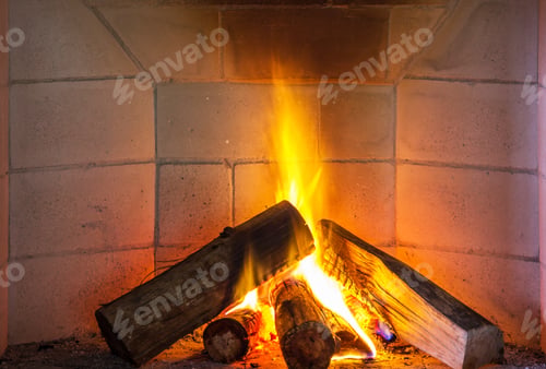 Preview: Flaming woods in a fireplace during winter