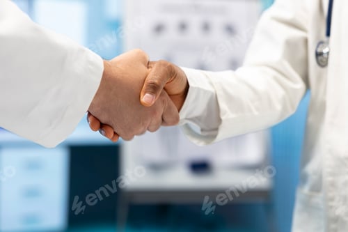 Preview: Medical staff doing a handshake at the end of the cabinet meeting