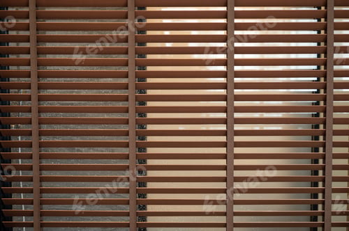 Preview: Pattern of brown wooden blinds on glass window