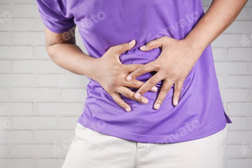 Preview: young man suffering stomach pain close up.
