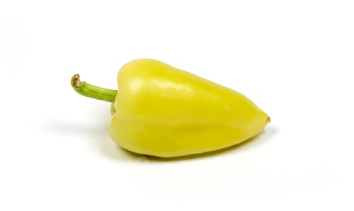 Preview: Closeup shot of a juicy green pepper isolated on a white background