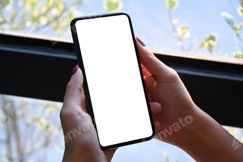 Preview: Mockup image of female hand holding smart phone. Blank screen for your text message .