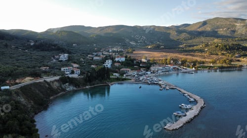 Preview: Aerial view of the tranquil sea and green hills with a town on the shore. Zakynthos, Keri
