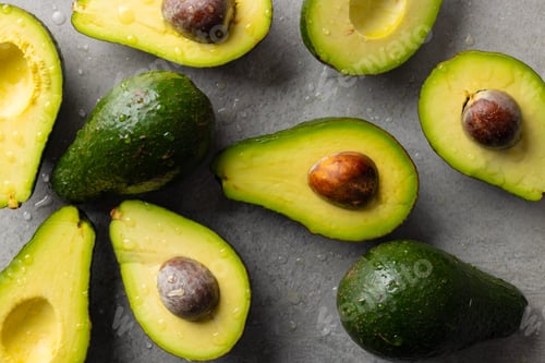 Preview: Micro close up of avocados with water drops and copy space on grey background