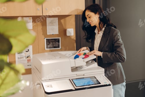 Preview: Office worker printing marketing pie chart on modern multifunction printer