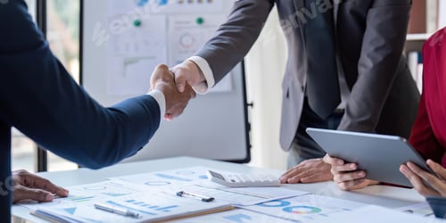 Preview: Shaking hand business leaders talk about charts, financial graphs showing results are analyzing and