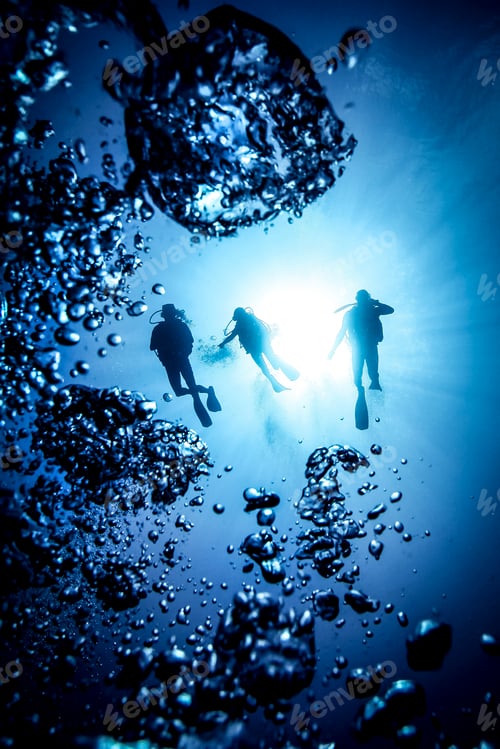 Preview: Underwater silhouette of three scuba divers and bubbles, Bali, Indonesia