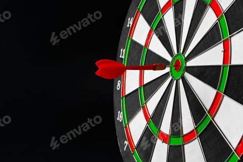 Preview: Dartboard on black dark background close up