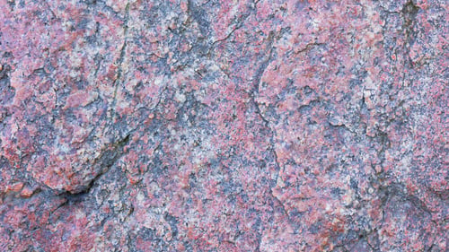Preview: Texture Of Granite. Granite With Reddish Color. Background From Solid Stone. Pattern With Natural