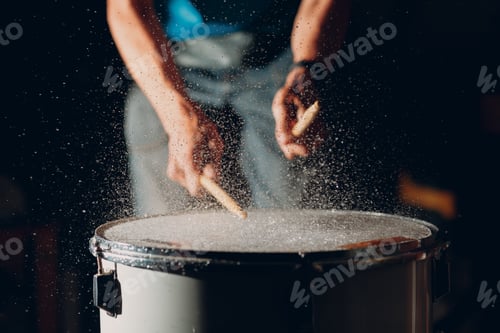 Preview: Drum sticks drumming beat rhythm on drum surface with splash water drops