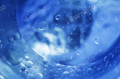 Preview: Oil bubbles close up. circles of water macro. abstract light blue background