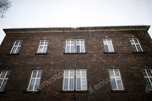 Preview: Beautiful old window on a brick wall background of an old house.