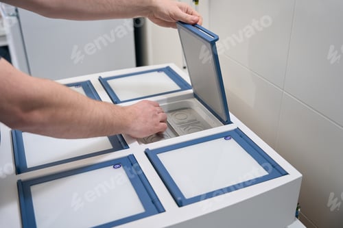 Preview: Employee of the genetic laboratory checks the incubator for embryos