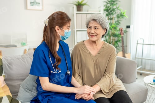Preview: Asian beautiful caregiver examine senior woman patient at nursing home.