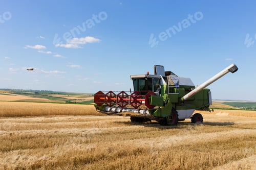 Preview: Combine harvester working on a wheat field.