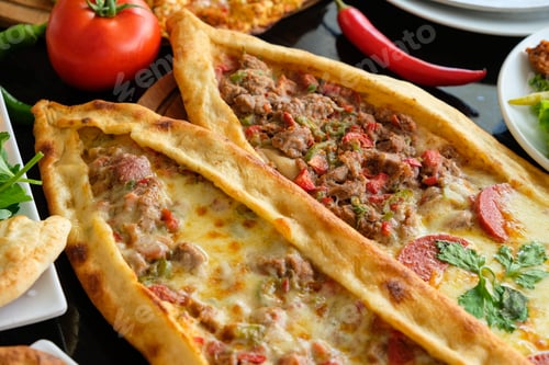 Preview: Close-up photo of pide pastries and Turkish pies with meat and cheese
