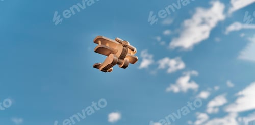 Preview: Wooden toy light aircraft biplane flying in the cloudy sky.
