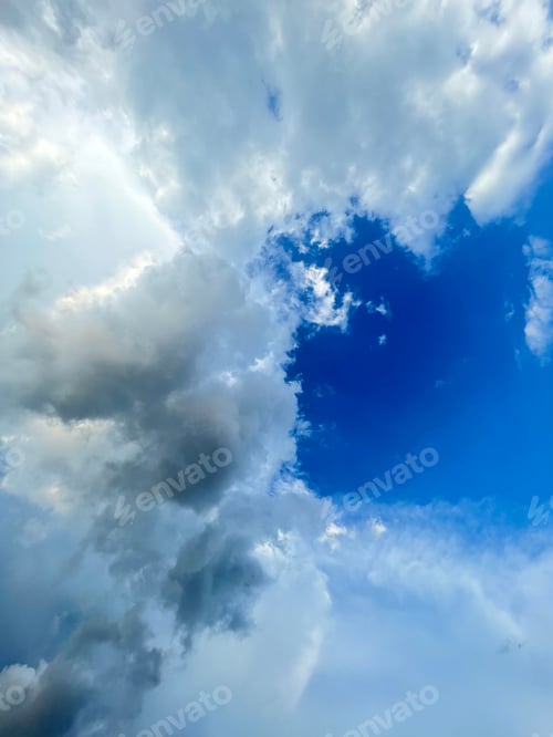 Preview: Picturesque view of fluffy white clouds on a sunny day