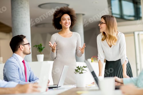 Preview: Business people discussing a strategy and working together in office
