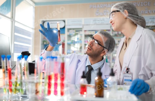 Preview: Pharmacist and chemical scientist doing antibiotic trials and testing in the laboratory