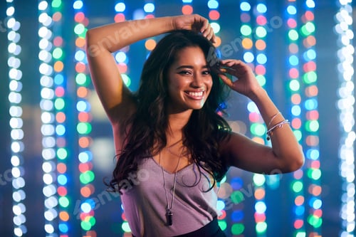 Preview: Can you feel the beat. Portrait of an attractive young woman dancing in a club.