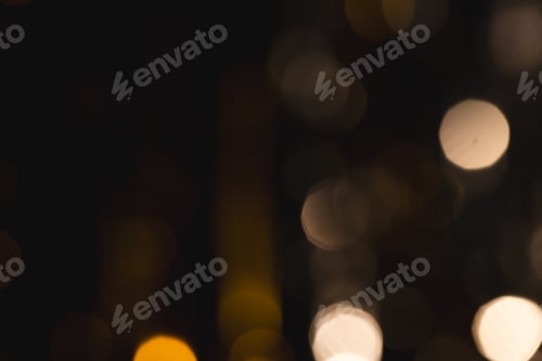Preview: Yellow bokeh lights with copy space on dark background