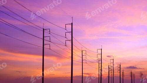 Preview: Silhouette row of electric poles with cable lines against colorful sunset sky background