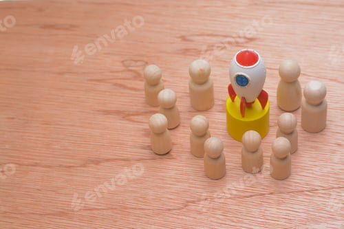 Preview: The wooden figures, clustered a symbolic rocket, epitomized the success strategy of a cohesive team