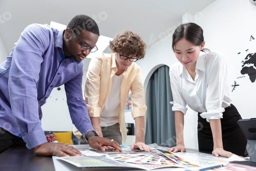 Preview: Teamwork designers brainstorm shared idea at modern office an using tablet with color sample on tabl